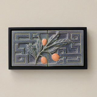 Sculpted decorative tile in wood frame by Rookwood