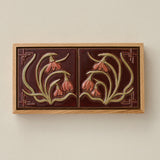 Sculpted decorative tile in wood frame by Rookwood