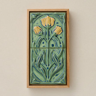 Sculpted decorative tile in wood frame by Rookwood
