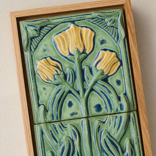Close-up details of the sculpted tile, with visible carvings and layered glaze.