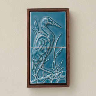 Sculpted decorative tile in wood frame by Rookwood