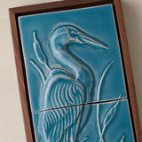 Close-up details of the sculpted tile, with visible carvings and layered glaze.