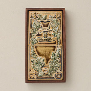 Sculpted decorative tile in wood frame by Rookwood