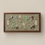 Sculpted decorative tile in wood frame by Rookwood
