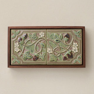 Sculpted decorative tile in wood frame by Rookwood