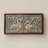 Sculpted decorative tile in wood frame by Rookwood