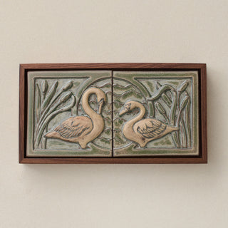 Sculpted decorative tile in wood frame by Rookwood