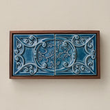 Sculpted decorative tile in wood frame by Rookwood