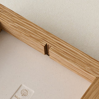 Back of wood frame with notch for easy hanging.