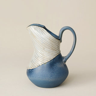Hand-thrown and hand-glazed ceramic pitcher by Rookwood Pottery