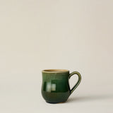 Hand-thrown and hand-glazed ceramic mug by Rookwood Pottery
