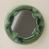 Hand-thrown and hand-glazed ceramic mirror by Rookwood Pottery