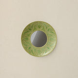 Hand-thrown and hand-glazed ceramic mirror by Rookwood Pottery