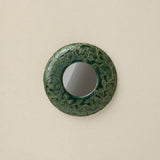 Hand-thrown and hand-glazed ceramic mirror by Rookwood Pottery